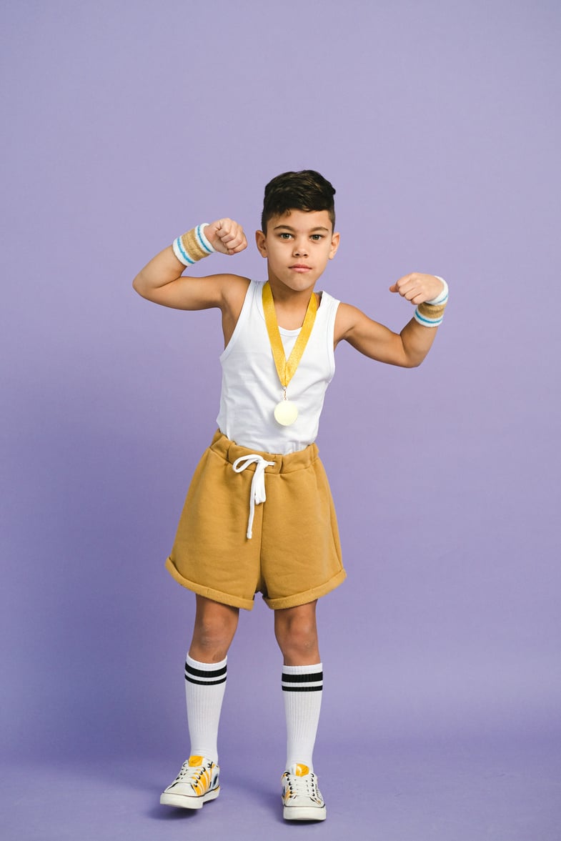 A Boy Wearing a Medal